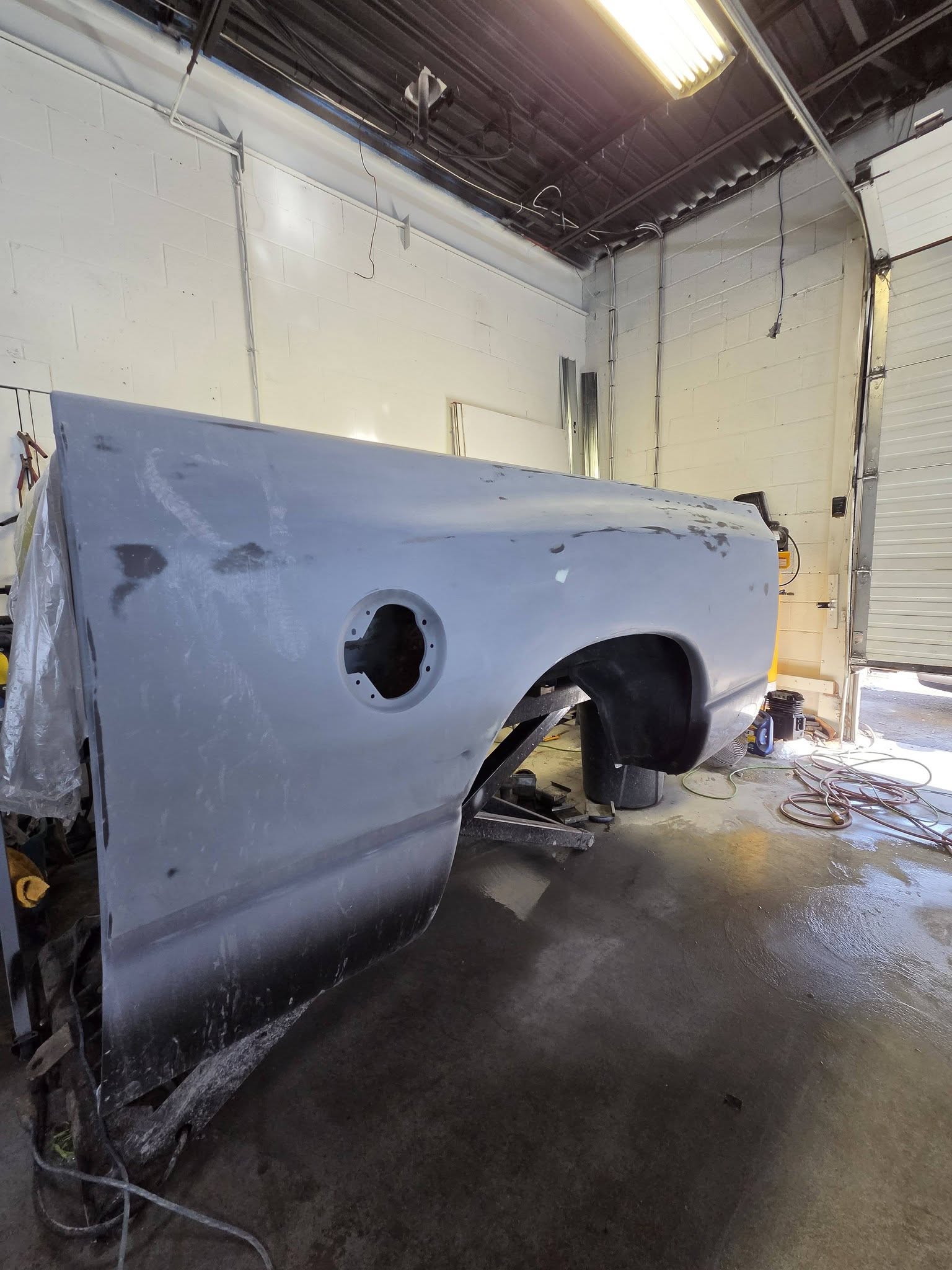 Rusted panel before cutting, welding, and refinishing